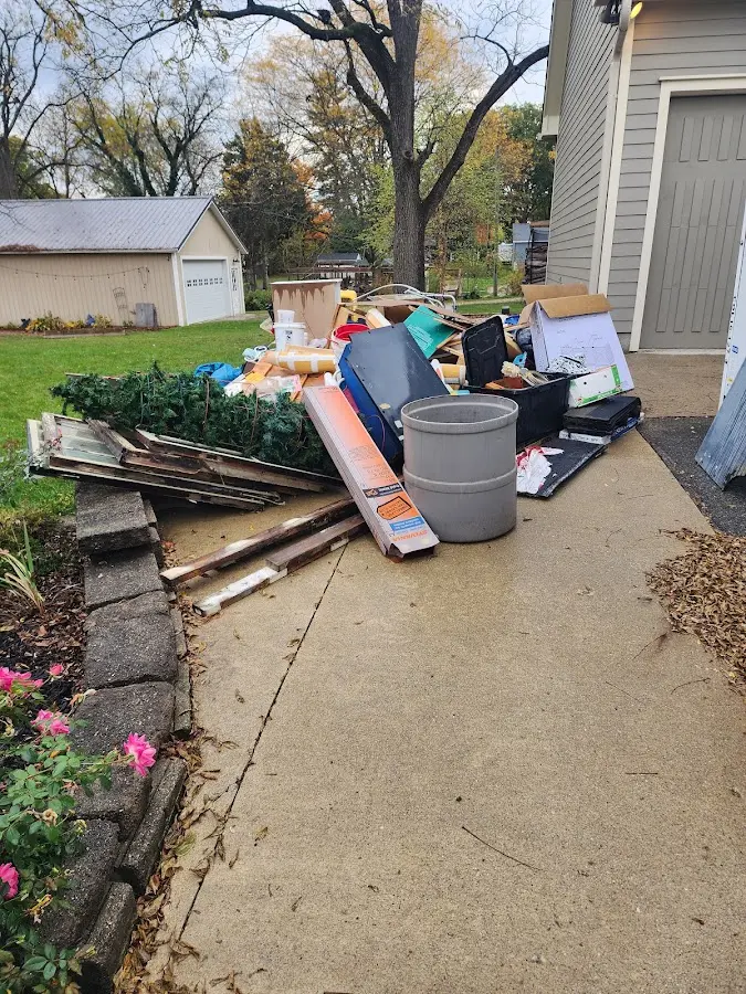Dumpster being loaded with debris for 3 Yard Dumpster Rental in North Riverside